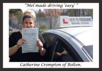 Catherine Crompton poses with her certificate after passing her driving test with Keys to Freedom Driving School Bolton.
